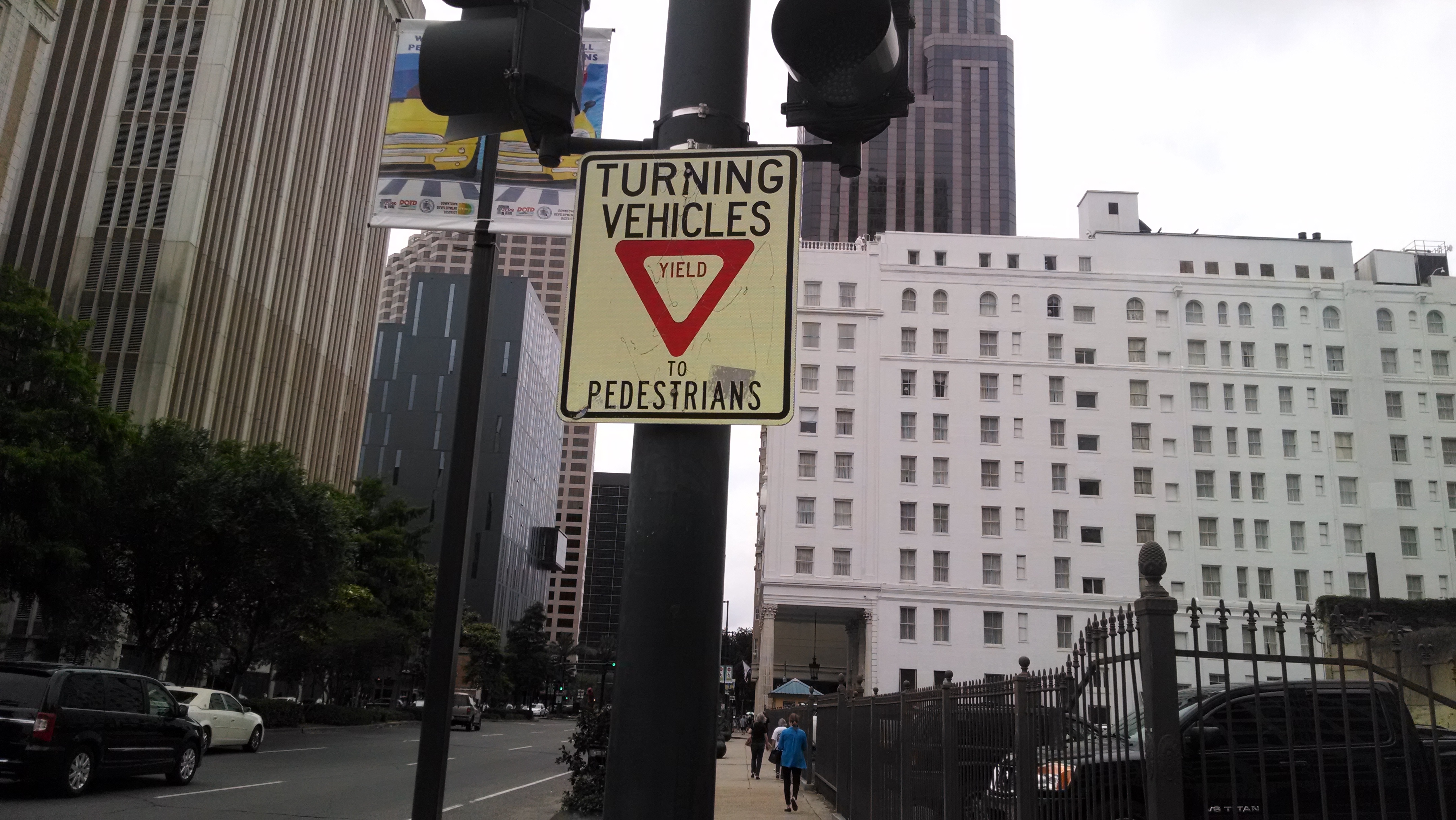 sign urging drivers to yield to pedestrians
